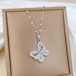 Detail of silver hollow butterfly pendant with zircon inlay in a premium gift box