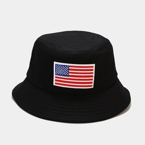 Close-up of embroidered American flag patch on a black canvas bucket hat with detailed stitching