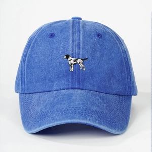 Close-up of realistic dog embroidery on washed navy cotton outdoor baseball cap