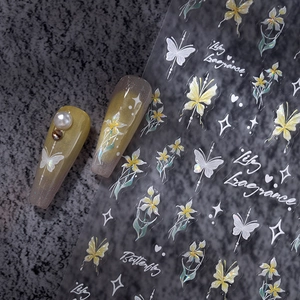 Self-adhesive nail stickers featuring white butterflies and lily patterns on gray stone