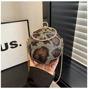 Close-up detail of leopard print sequin evening sphere bag with gold ring handle