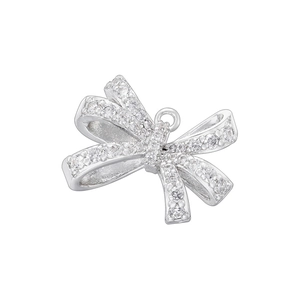 Macro view of a silver bow pendant with sparkling pave-set cubic zirconia crystals