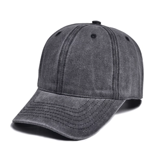 Detail of dark grey washed cotton baseball cap with retro six-panel design and stitched brim