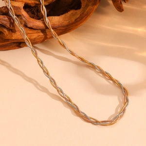 Three-tone braided snake chain necklace in gold, rose gold, and silver stainless steel
