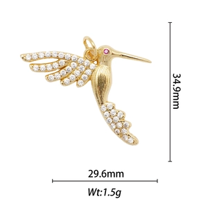 Detailed view of 18k gold-plated hummingbird pendant with dimensions 34.9mm by 29.6mm