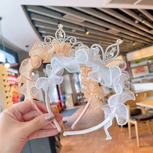 Close-up of girls' tulle headbands featuring sparkling crown and star rhinestone details