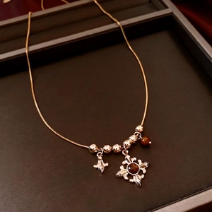 Tiger eye beads necklace with vintage cross and flower pendants on gold snake chain