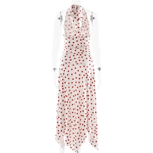 Detail of white halter neck dress with red polka dots and pleated waist features