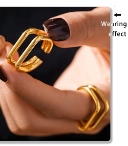 Close-up of a double-layered gold U-shape open ring showing the stylish wearing effect