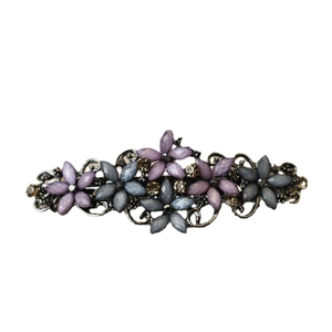 Vintage alloy spring hair clip with purple blue rhinestone flowers on dark metal base