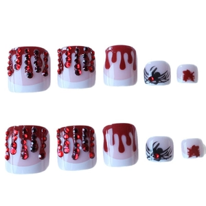 Halloween toe nail press-ons with blood drip design and red rhinestone spiders