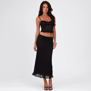 Detailed view of the black lace stitching and sheer fabric of this slim fit maxi dress set