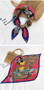 Detail of pleated silk scarf with colorful geometric print and zig-zag edges