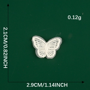 Macro detail of white lace butterfly patch showing 2.1cm height and 2.9cm width