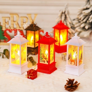 Close-up of lighted Christmas lanterns with Santa and Elk patterns for holiday decor