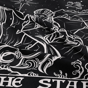 Macro detail of The Star tarot tapestry fabric showing white screen print on black polyester