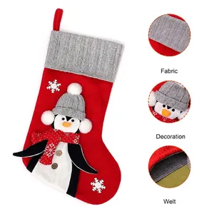 Christmas penguin stocking with gray cable knit cuff and festive 3D embroidery details