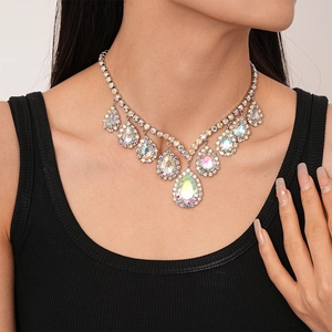 Macro detail of V-shaped teardrop crystal necklace with shimmering AB rhinestones