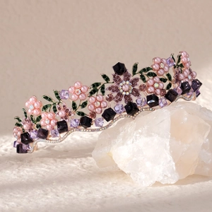 Floral bridal tiara with pink pearls and purple crystals on golden metal frame
