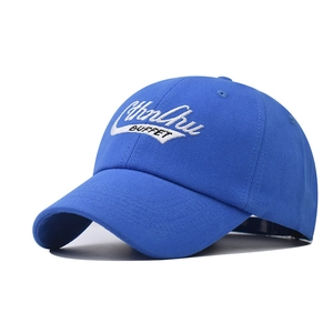 Detail of royal blue cotton baseball cap featuring 3D white embroidered calligraphy logo