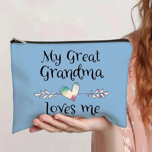 Detail of blue canvas makeup bag with My Great Grandma loves me print and black zipper