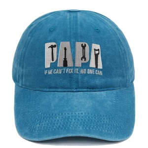 Close-up of blue washed cotton baseball cap with PAPA embroidery and tool icons