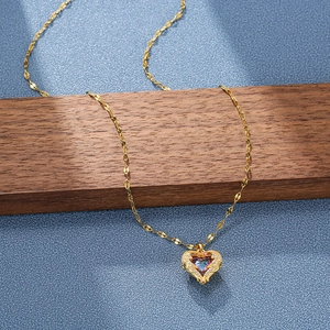 Golden heart pendant necklace with iridescent zircon and micro-inlaid diamonds