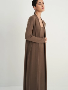 Close-up of soft knitted long cardigan and matching coffee brown maxi dress set
