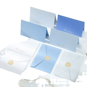 Elegant gold-stamped greeting card set with envelopes in white and shades of blue