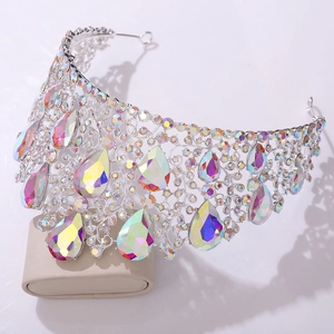 Ornate silver baroque tiara featuring large pear-cut iridescent crystals and rhinestones