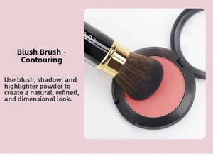 Detailed view of bicolor fiber blush brush with black handle and gold metal ferrule