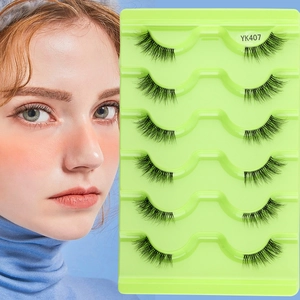 Detail of half false eyelashes set with clear band for a natural winged eye look