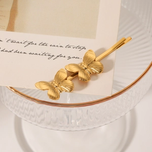 Barrette papillon élégante en acier inoxydable plaqué or 18 carats sur plateau