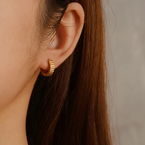 Chic 18K gold plated stainless steel C-shaped hoop earrings with textured relief pattern