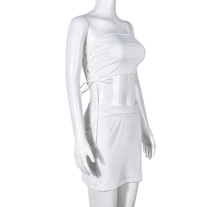 Detail of white ribbed knit tube top and mini skirt set with adjustable side drawstrings