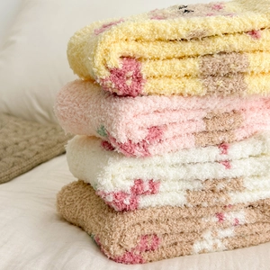 Cozy coral fleece sleeping socks in 4 colors featuring soft plush texture for winter