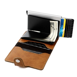 Detail of RFID-blocking leather wallet showing the pop-up card mechanism and bill clip
