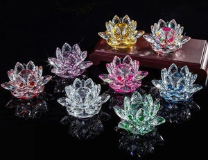 Detailed view of colorful crystal lotus candle holders in gold, pink, blue, and green colors