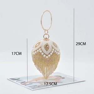 Elegant gold and pearl sphere evening clutch bag with fringe tassels and metal ring handle