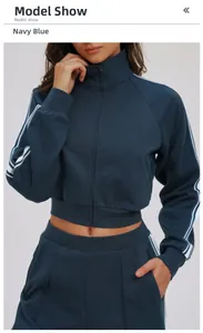 Navy blue tracksuit detail with high-neck zip jacket and white side stripes