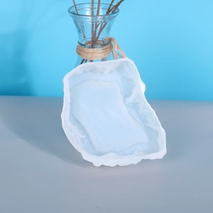 Macro detail of translucent silicone resin mold with natural rock wave textures