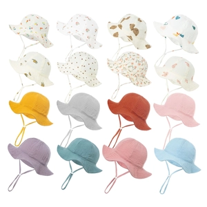 Baby cotton sun hats in various prints and solid colors with adjustable chin straps