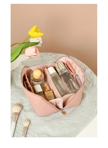 Interior view of pink PU leather makeup bag showing multiple compartments and storage space