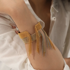 Two-tone stainless steel beaded tassel bangle with a minimalist open design for women