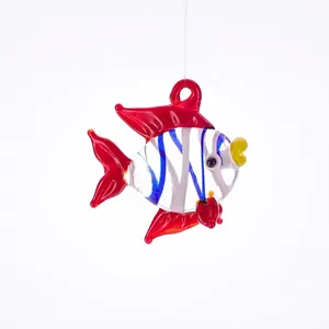 Detailed view of a handmade glass fish pendant with blue stripes and transparent red fins