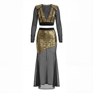 Detail of gold sequins and black mesh patchwork on the long sleeve party dress