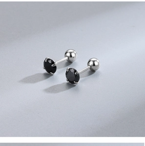 Macro shot of black round-cut gemstone stud earrings with threaded screw back details