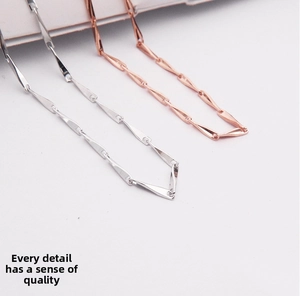 Detail view showing textured S925 silver and rose gold link necklace chains