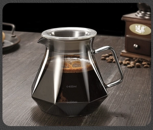 Macro shot of a faceted glass coffee server with 200ml and 400ml capacity scale marks
