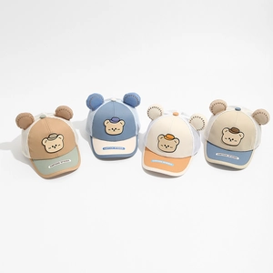 Flat lay of breathable mesh baby baseball caps with 3D ears and cartoon bear design
